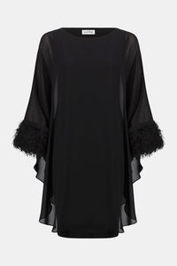 Joseph Ribkoff black silky knit and chiffon layered dress with fringe cuff detail, boat neckline and dolman sleeves, elegant women’s occasion dress at Hollie Rose.
