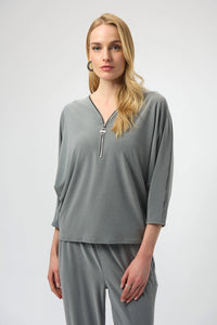 Joseph Ribkoff melange silky knit boxy top with V-neck zipper detail and dolman sleeves, relaxed women’s top available at Hollie Rose.
