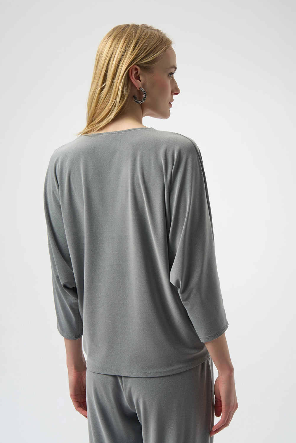 Joseph Ribkoff melange silky knit boxy top with V-neck zipper detail and dolman sleeves, relaxed women’s top available at Hollie Rose.

