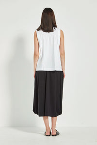 VERGE Acrobat Emi Skirt in Black with soft basque waist, pockets and draped side panels, modern women’s skirt available at Hollie Rose.
