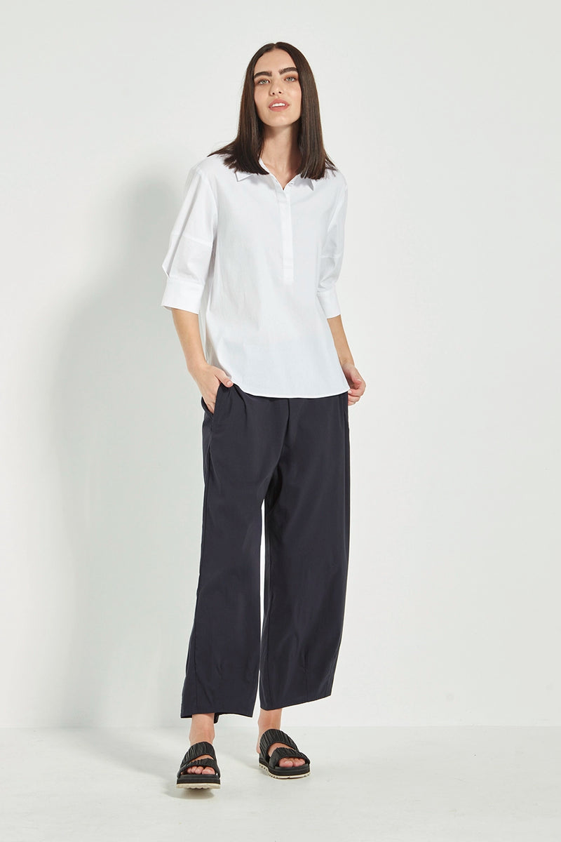 VERGE Acrobat Cove Pant in Black with tapered barrel-leg silhouette, elastic back waist and slant pockets, women’s pant at Hollie Rose.

