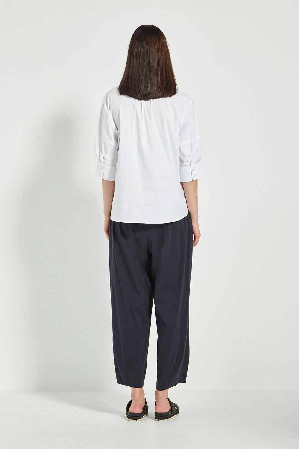 VERGE Acrobat Cove Pant in Black with tapered barrel-leg silhouette, elastic back waist and slant pockets, women’s pant at Hollie Rose.
