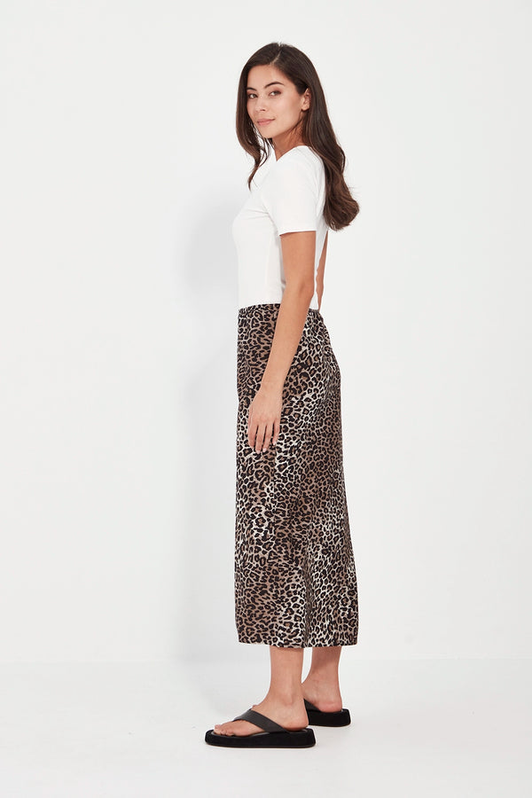 VERGE Instinct Skirt in exclusive animal print, bias-cut rayon-linen blend with mid-calf length and elastic waistband, women’s skirt at Hollie Rose.
