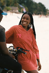 Shop Kinga Csilla Team KC Tee Dress in washed cotton with sporty stripe sleeves, relaxed V-neck and oversized fit at Hollie Rose. Free Shipping, Afterpay & ZipPay.
