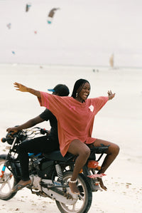 Shop Kinga Csilla Team KC Tee Dress in washed cotton with sporty stripe sleeves, relaxed V-neck and oversized fit at Hollie Rose. Free Shipping, Afterpay & ZipPay.
